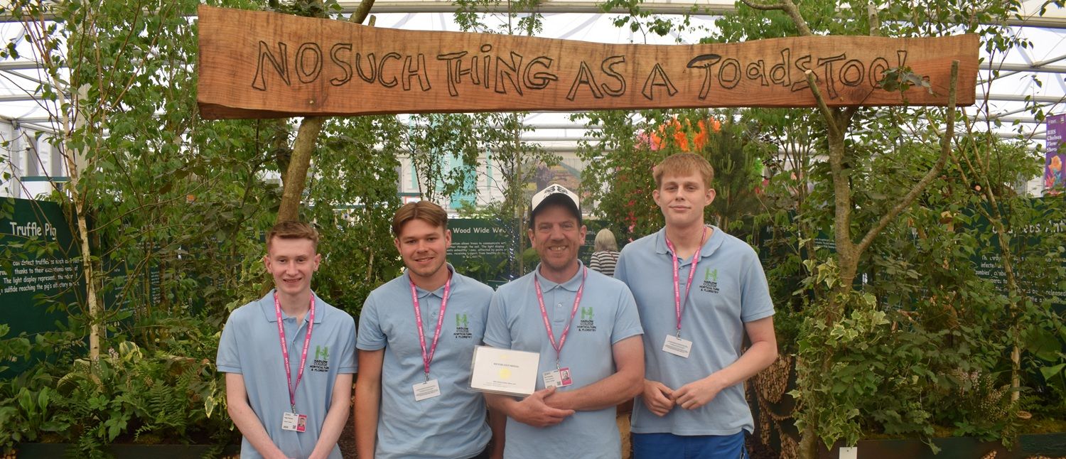 Staff and students at Chelsea Flower Show with certificate