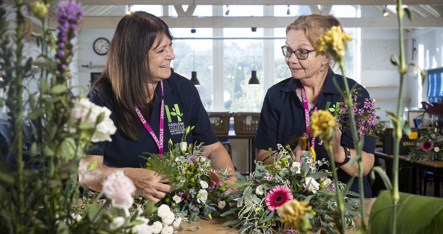 Two tutors with flowers