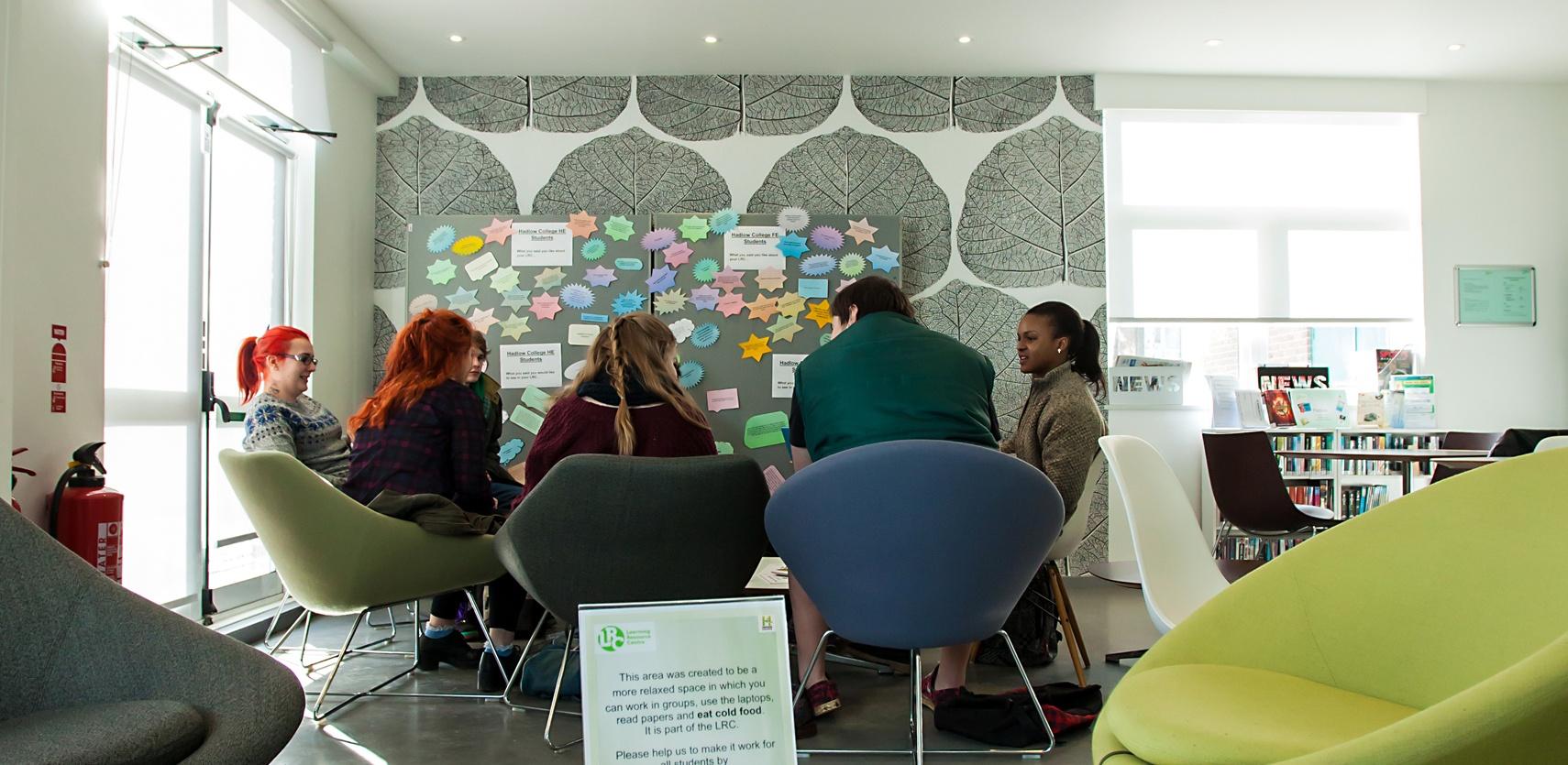 Hadlow students sitting around a table in the learning resource centre