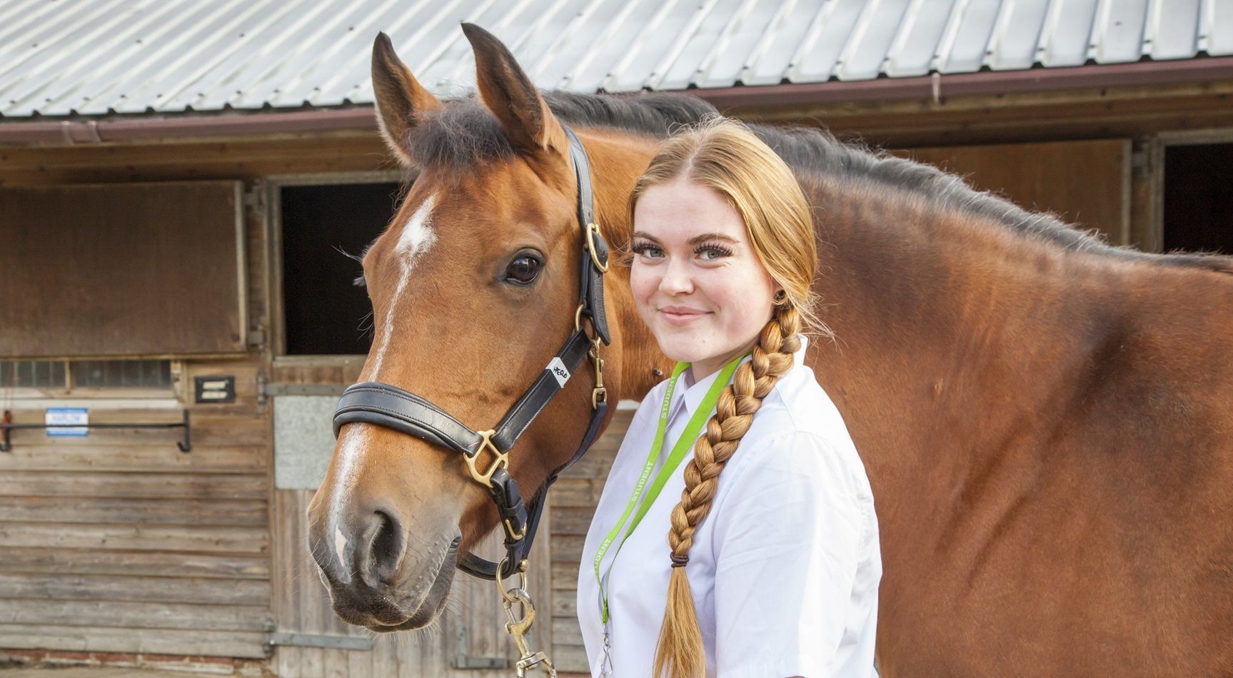 Young student in front of horse