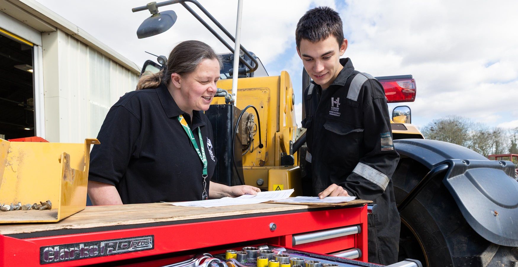 Student and teacher in agricultural engineering workshop
