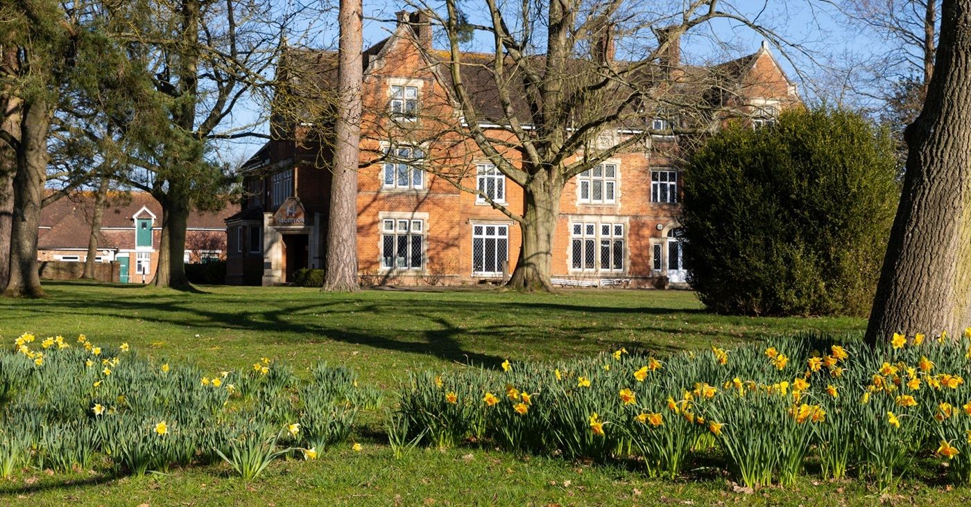 flowers in front of Hadlow building