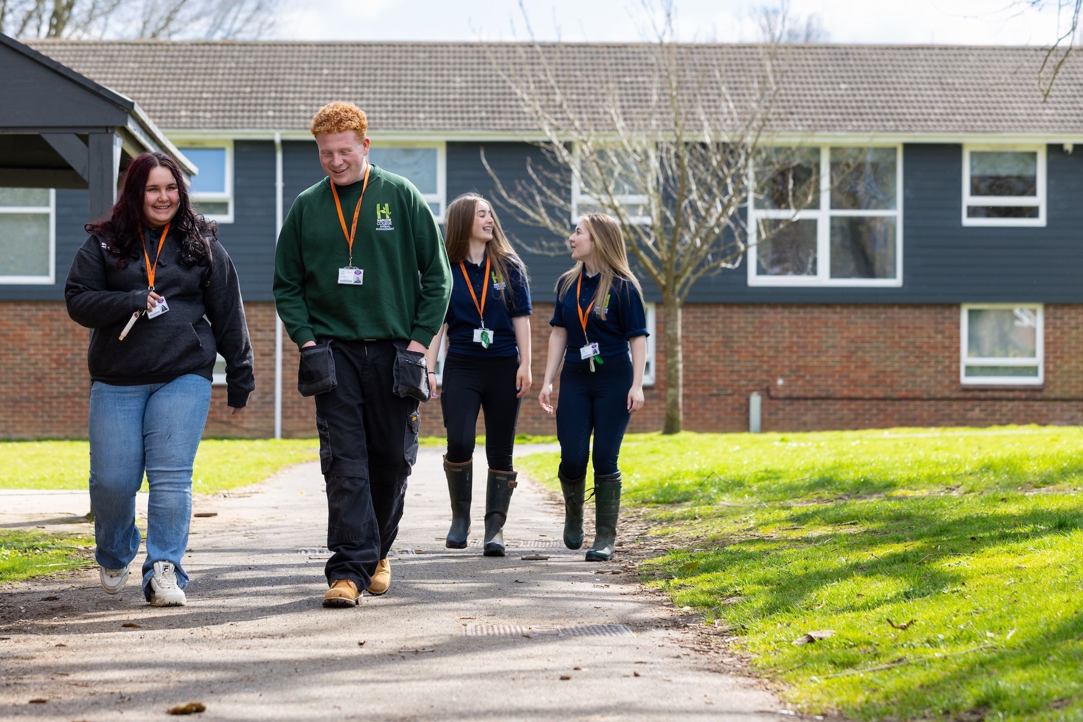 Hadlow College students walking in front of building