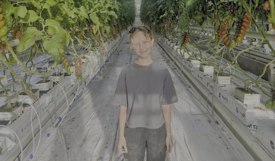 NKC Hadlow College staff member Lily Browning in glasshouse