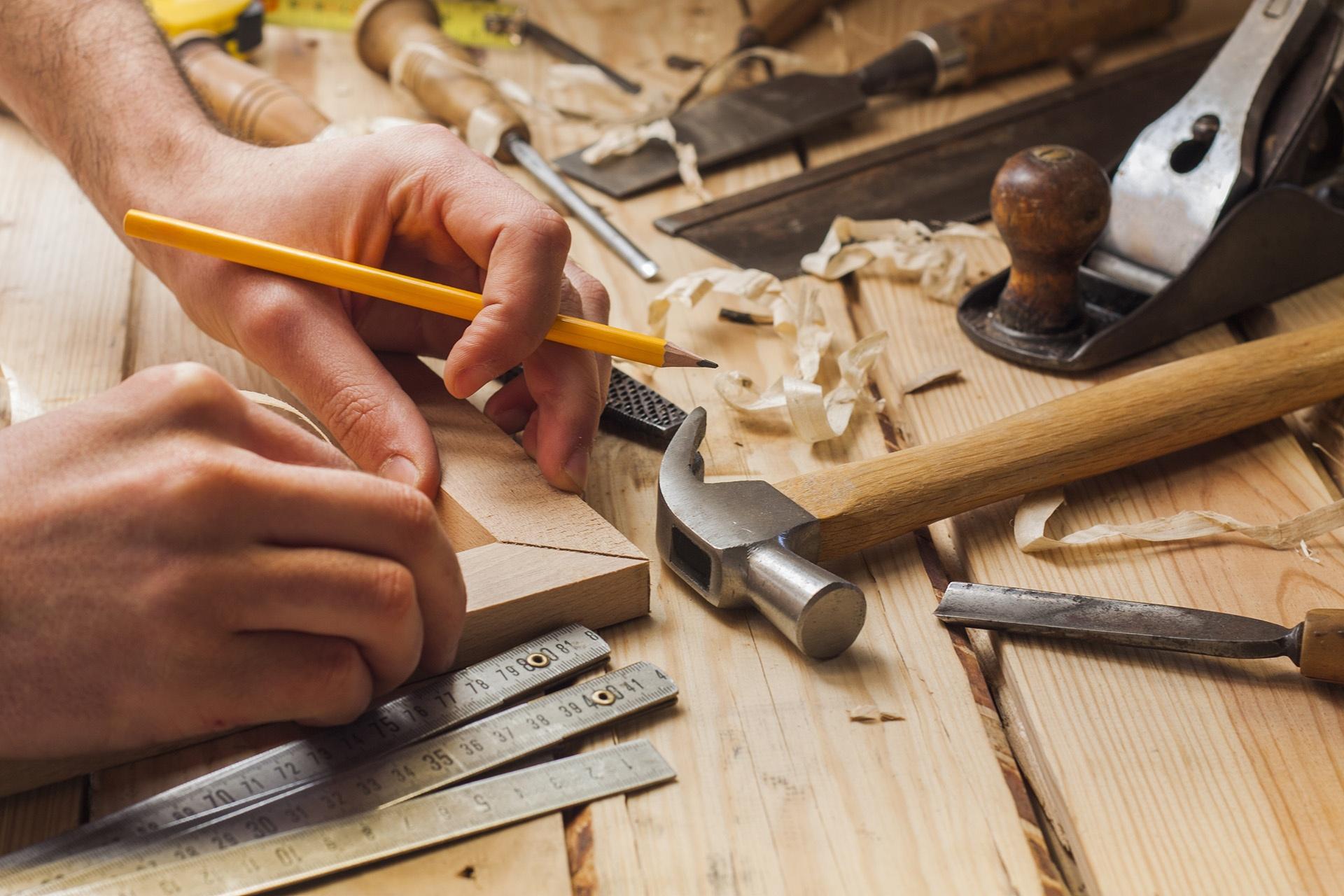 Student measuring pieces of wood