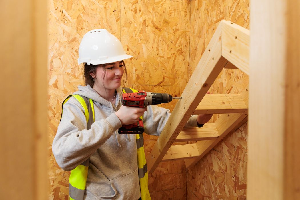 hadlow-college-carpentry-female-student-drilling-wood-2026-