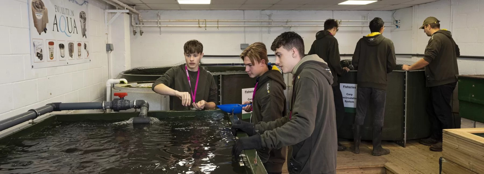 hadlow-fisheries-students-feeding-fish