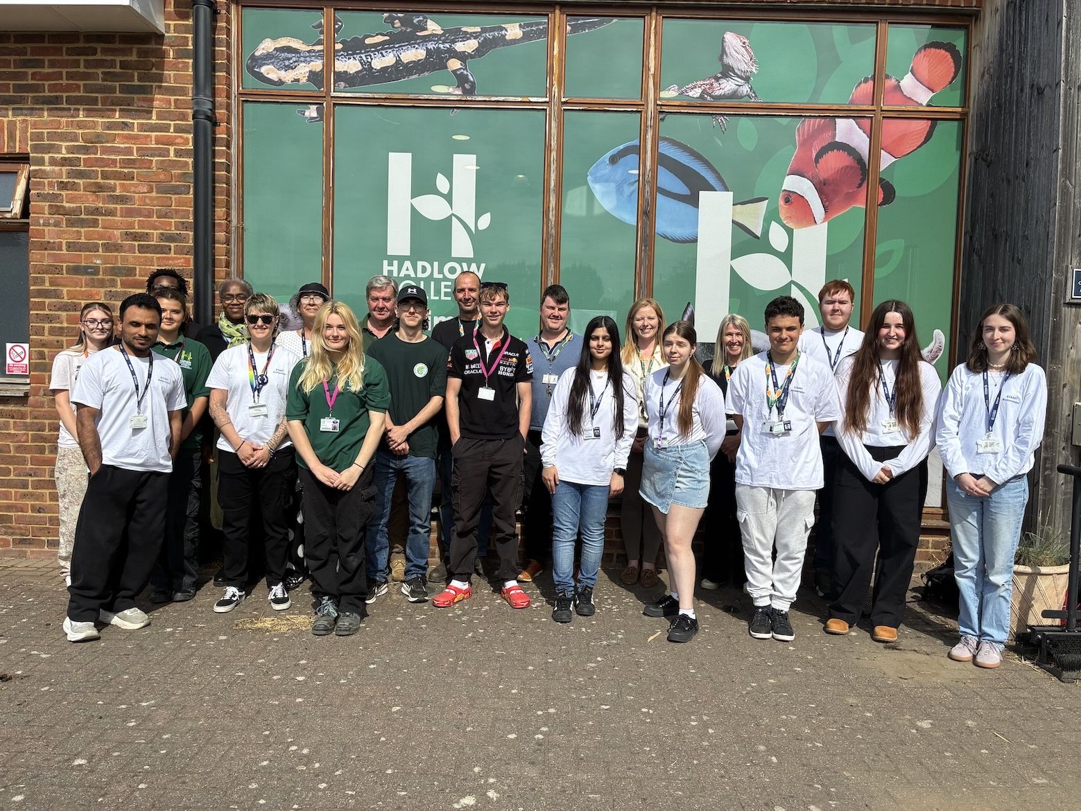 Students standing in front of Hadlow College sign